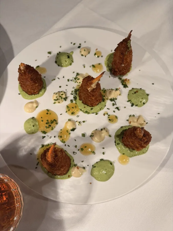 Plated croquettes with herb sauce